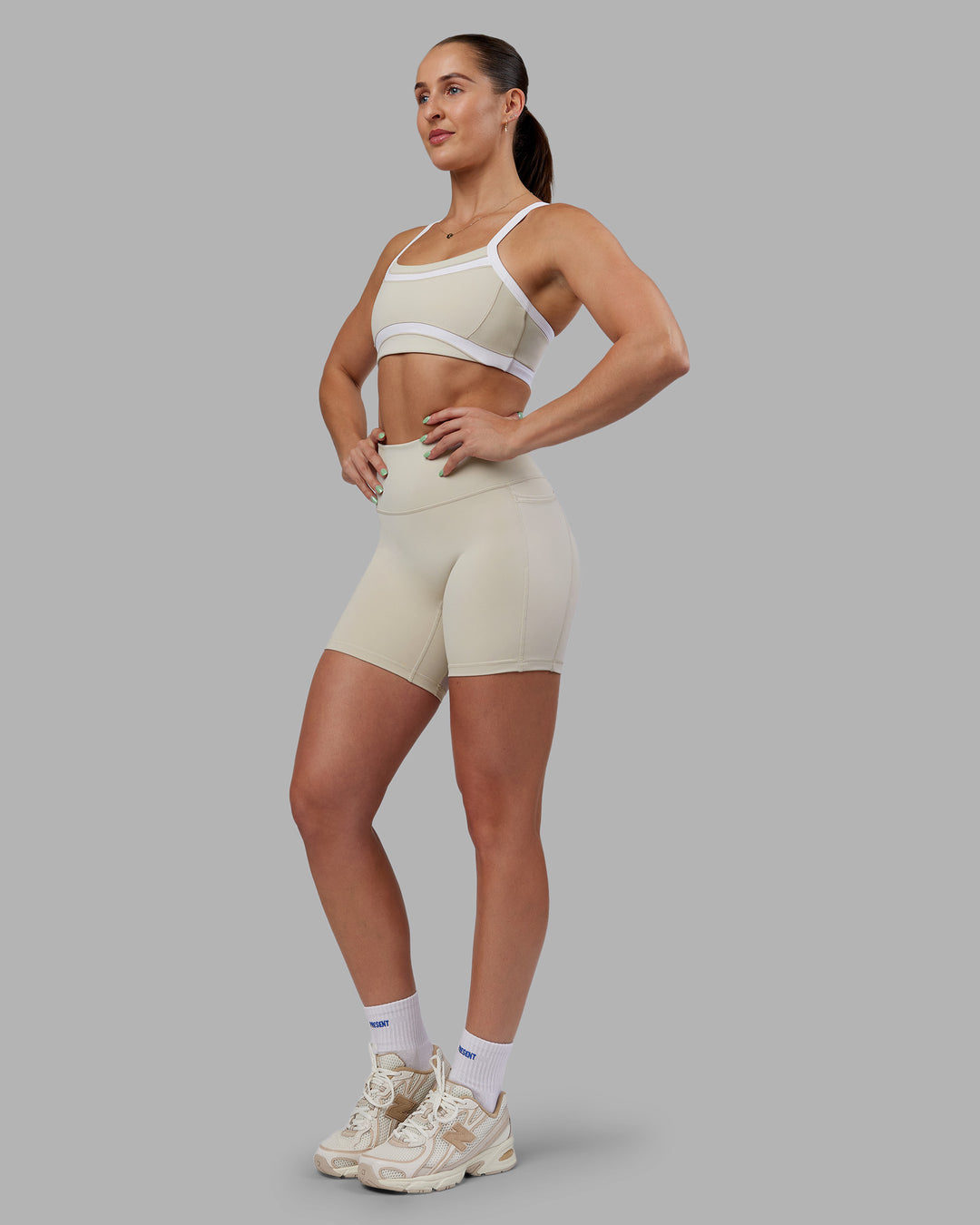 Woman wearing Abs Fusion High-Rise 6" Short Pockets - Shale Beige | Model:Abbey | Size:S