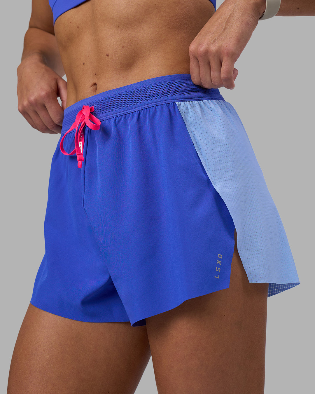 Woman wearing Accelerate 3" High-Rise Running Short - Power Cobalt-Open Air | Model:Hannah | Size:S