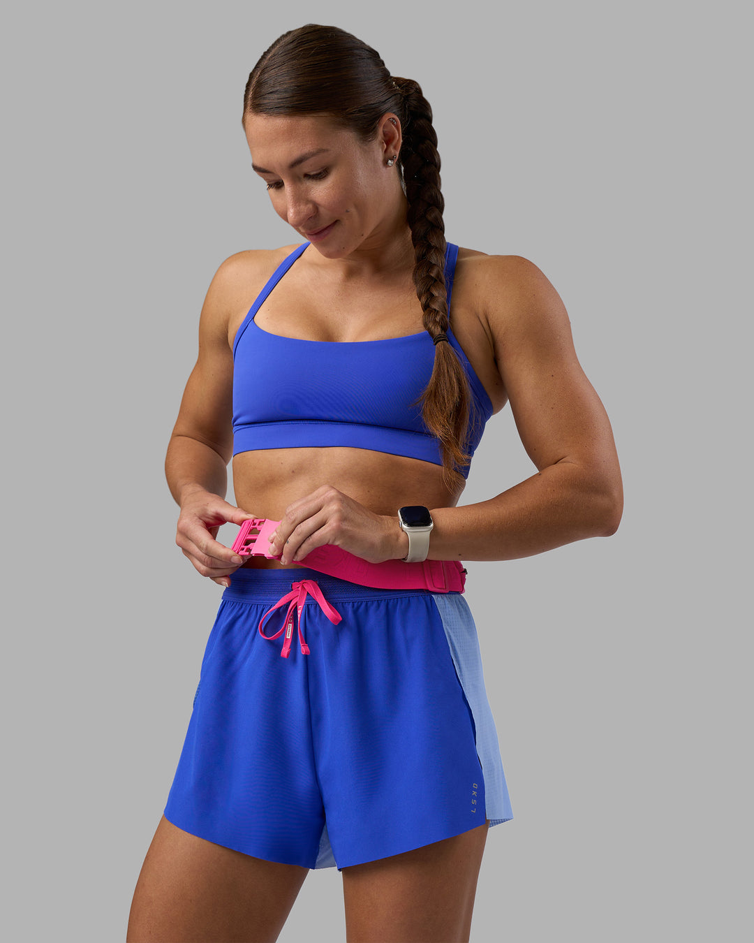 Woman wearing Accelerate 3" High-Rise Running Short - Power Cobalt-Open Air | Model:Hannah | Size:S