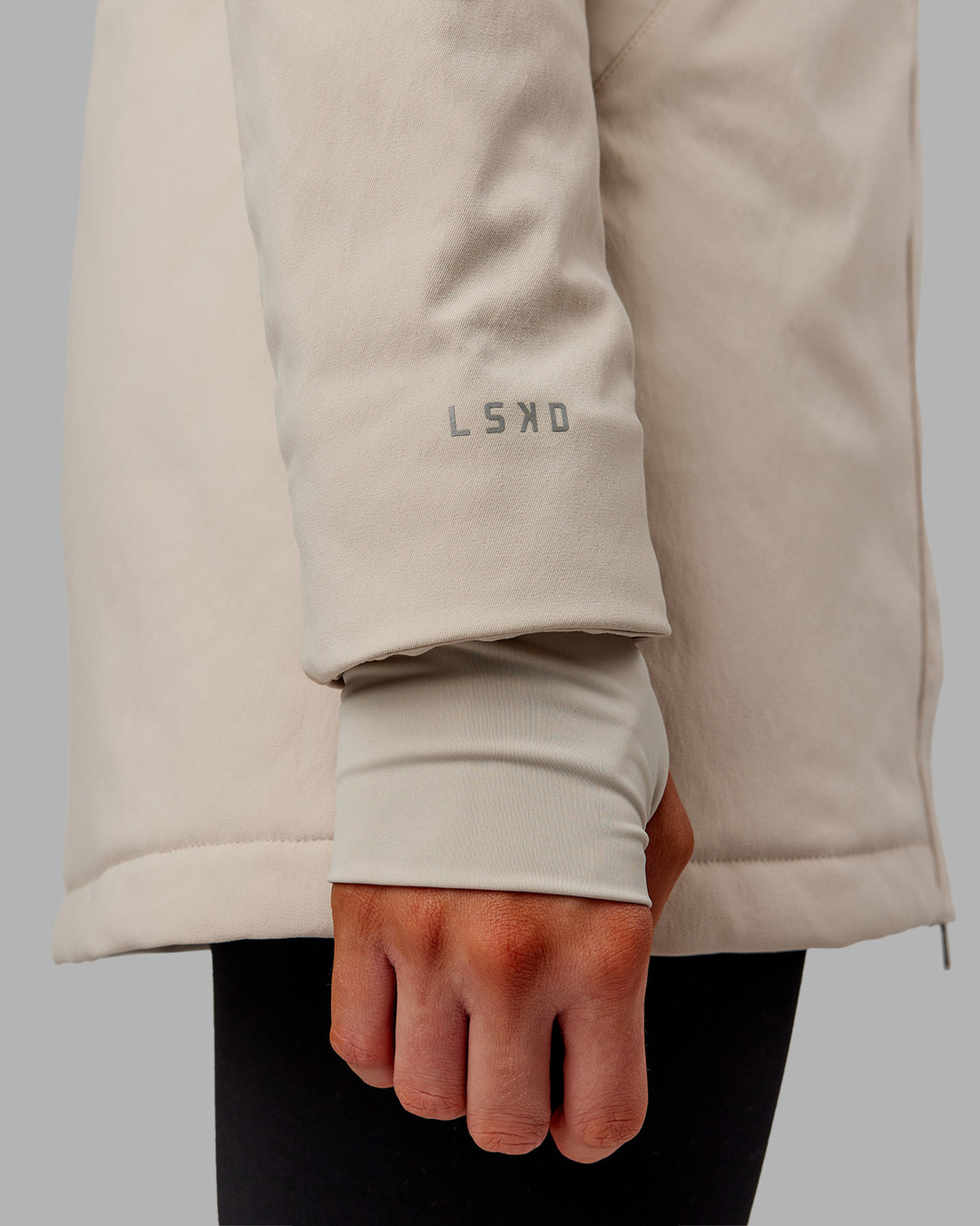 Woman wearing Auxiliary 2.0 Jacket - Shale Beige | Model:Ella | Size:S