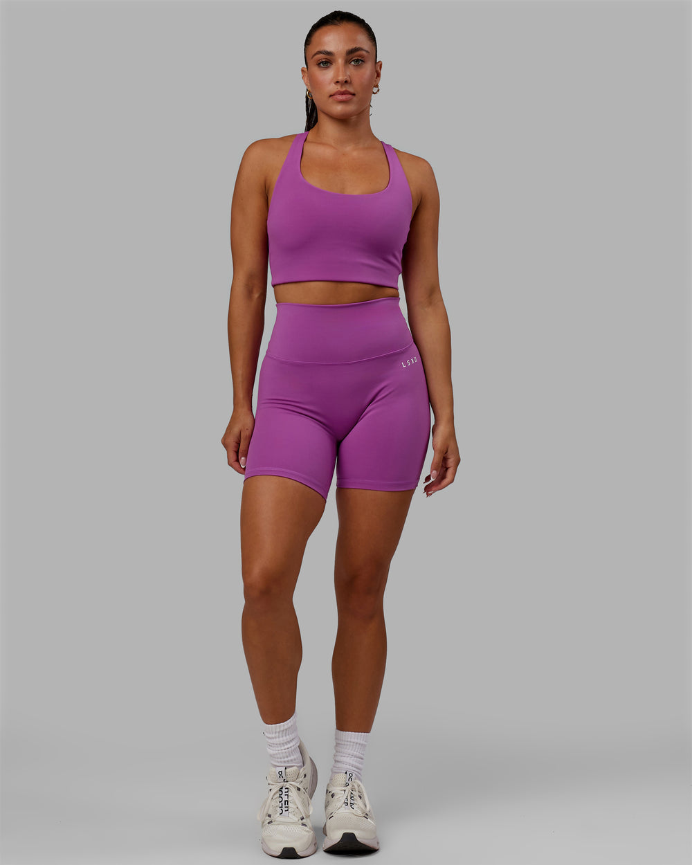 Woman wearing Base 2.0 Mid Short Tight - Hyper Violet