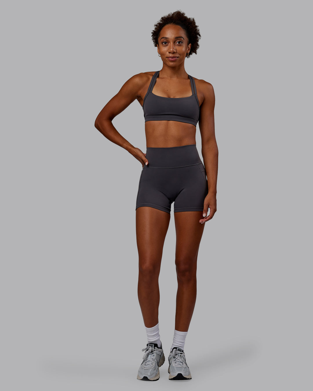 Woman wearing Bree Masters Fusion Ultra High-Rise 4" Short Pockets - Stormy