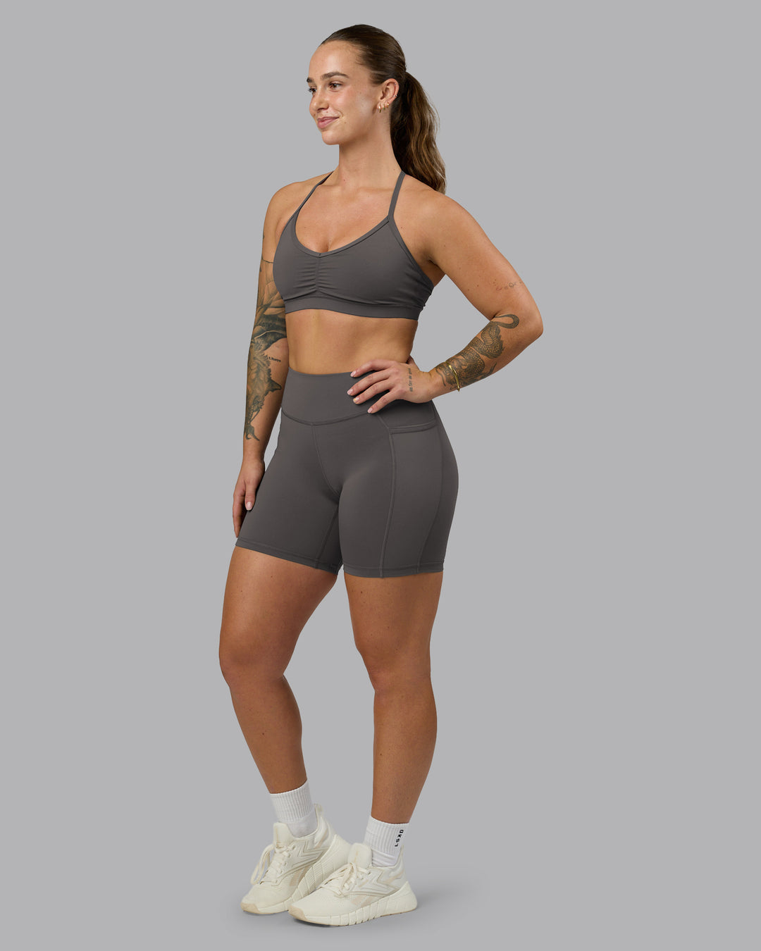 Woman wearing Clarity Sports Bra - Dark Storm | Model:Robyn | Size:S