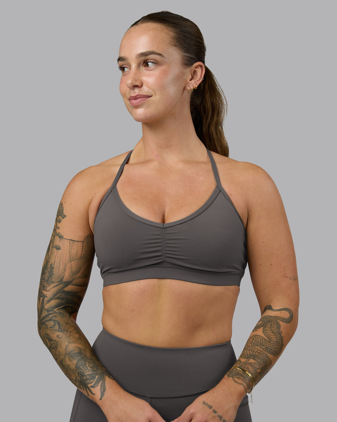 Woman wearing Clarity Sports Bra - Dark Storm | Model:Robyn | Size:S