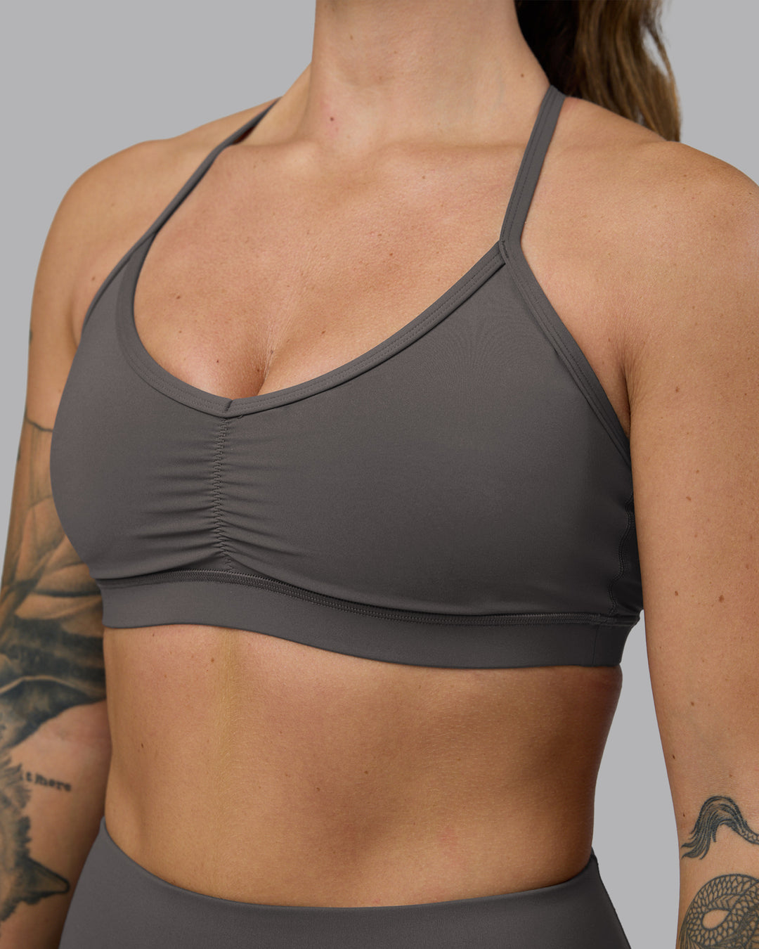 Woman wearing Clarity Sports Bra - Dark Storm | Model:Robyn | Size:S