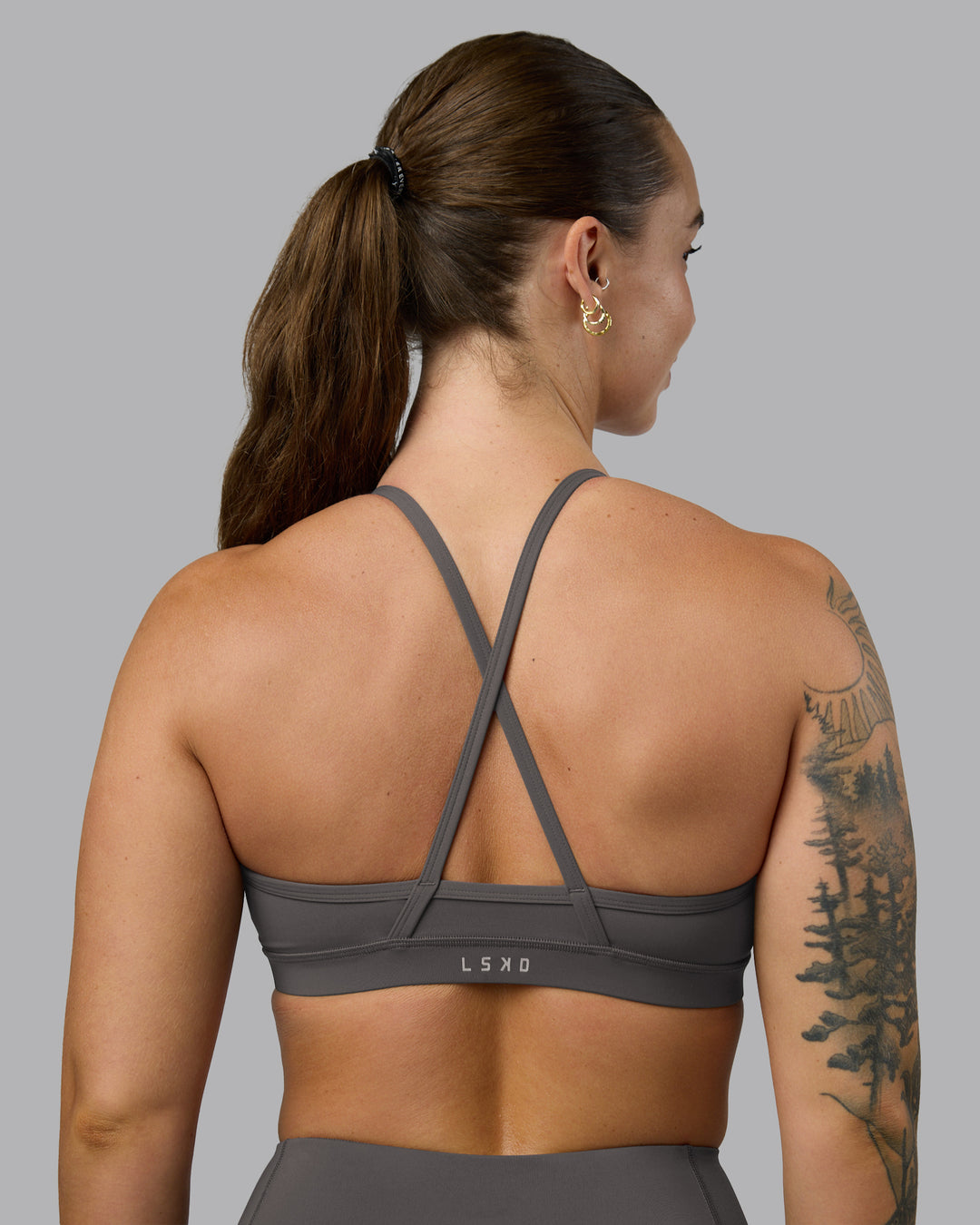 Woman wearing Clarity Sports Bra - Dark Storm | Model:Robyn | Size:S