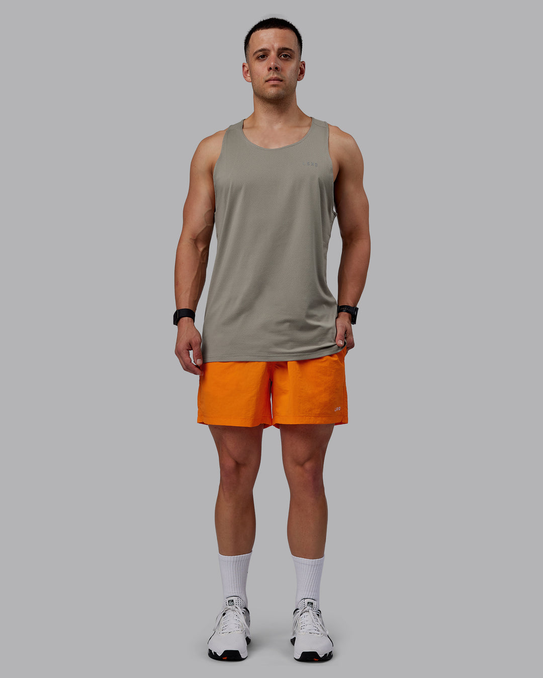 Man wearing Classic 5" Shorts - Vibrant Orange