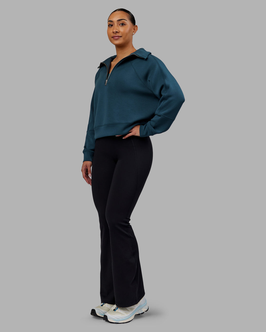 Woman wearing Elevate SoftTouch 1/2 Zip Sweater - Deep Sea | Model:Ayla | Size:S