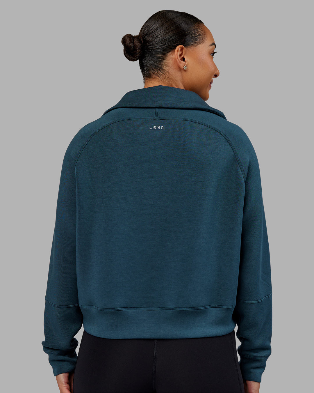 Woman wearing Elevate SoftTouch 1/2 Zip Sweater - Deep Sea | Model:Ayla | Size:S