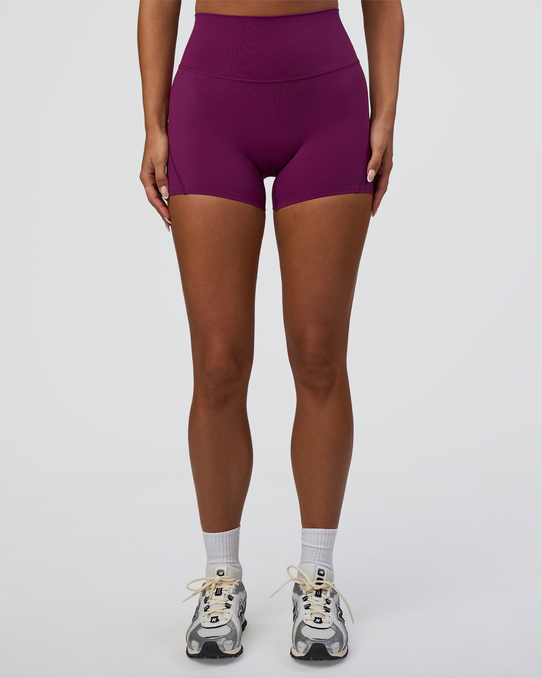 Woman wearing Elixir Defined High-Rise 4" Short - Plum Caspia | Model:Bianca | Size:S