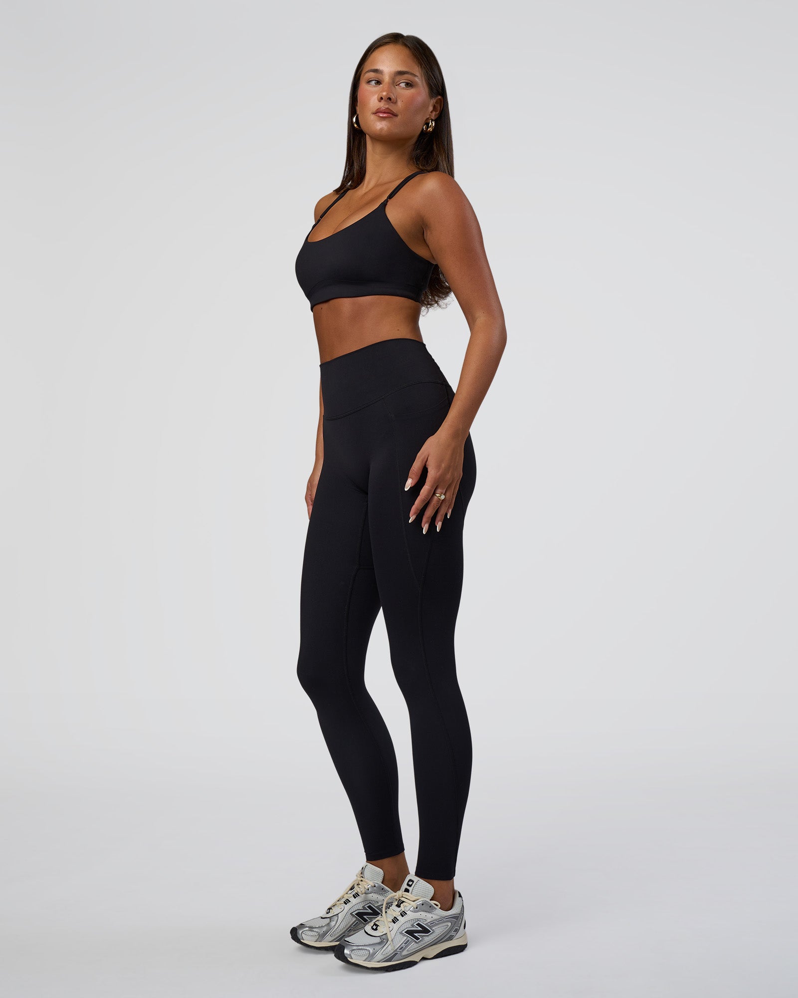 Woman wearing Elixir Defined High-Rise Full Length Legging Pockets - Black | Model:Bianca | Size:S