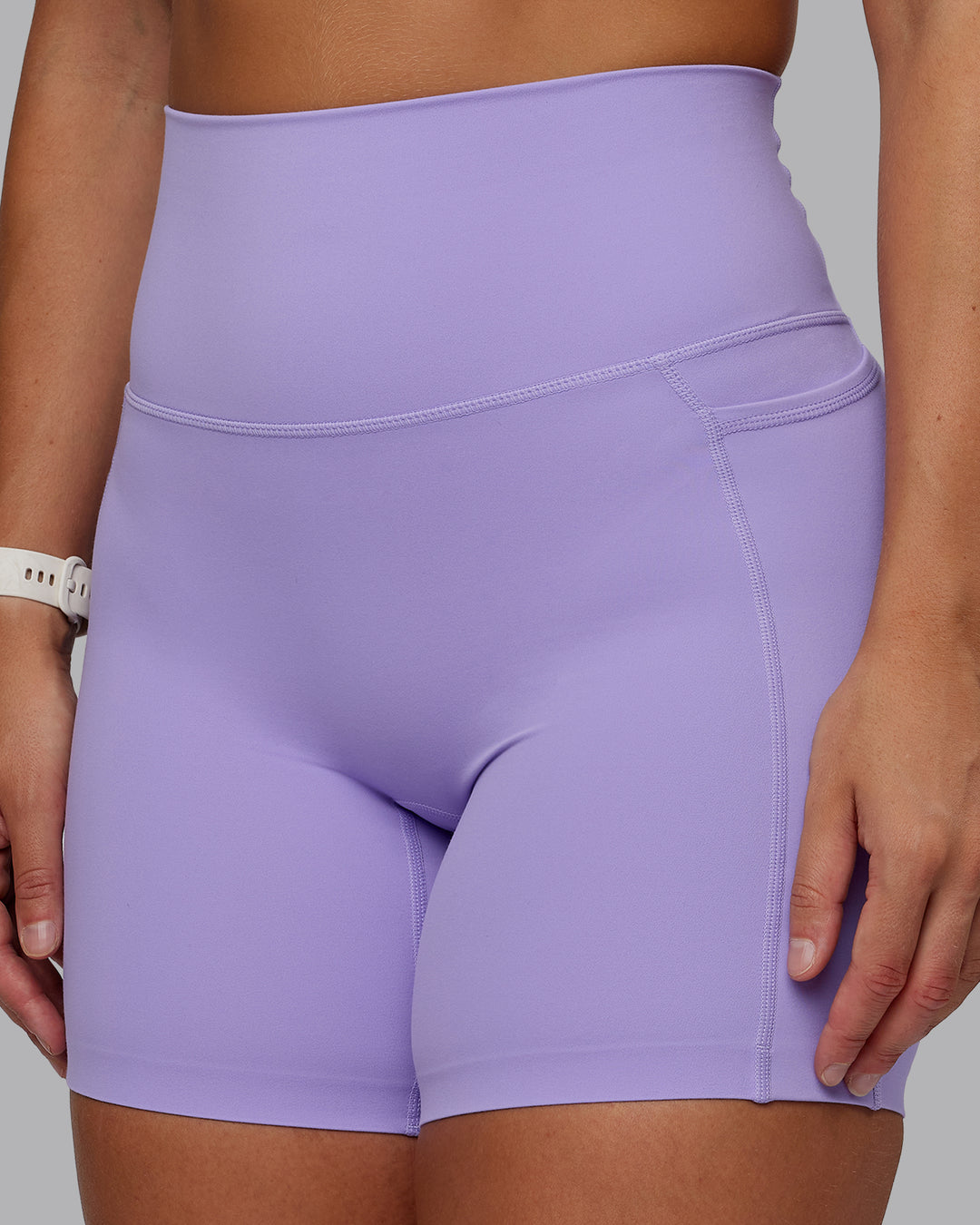 Woman wearing Elixir Ultra High-Rise 6" Short Pockets - Violet Ray | Size:S