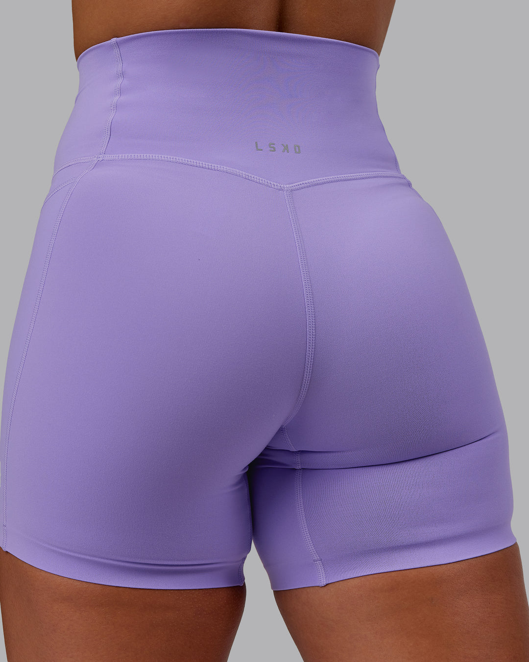 Woman wearing Elixir Ultra High-Rise 6" Short Pockets - Violet Ray | Size:S