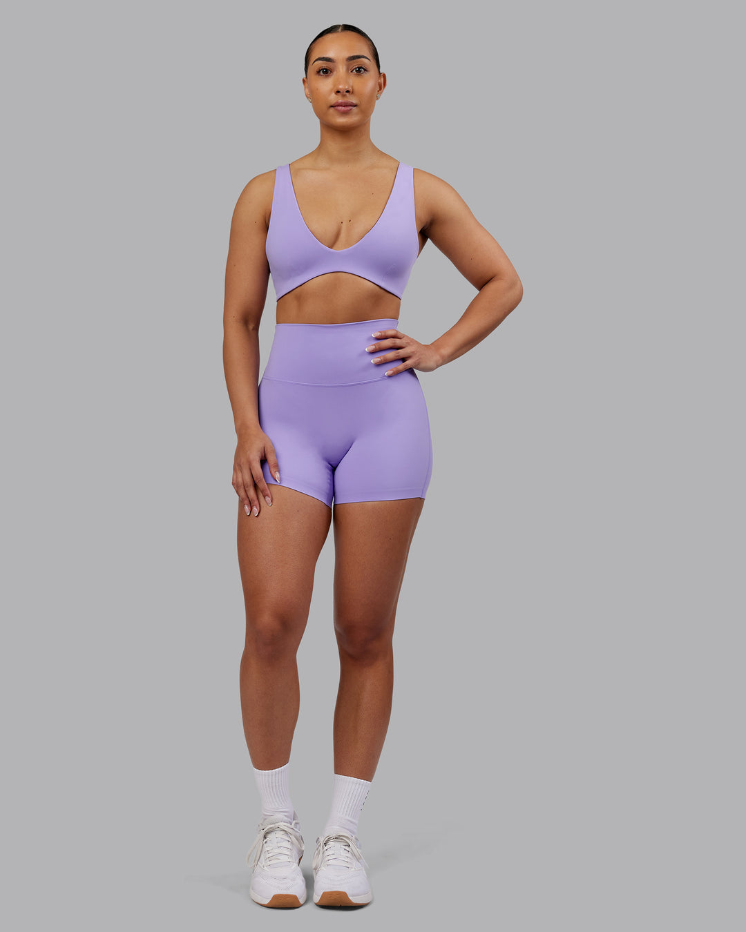 Woman wearing Elixir Ultra High-Rise 4" Short - Violet Ray | Model:Ayla | Size:S