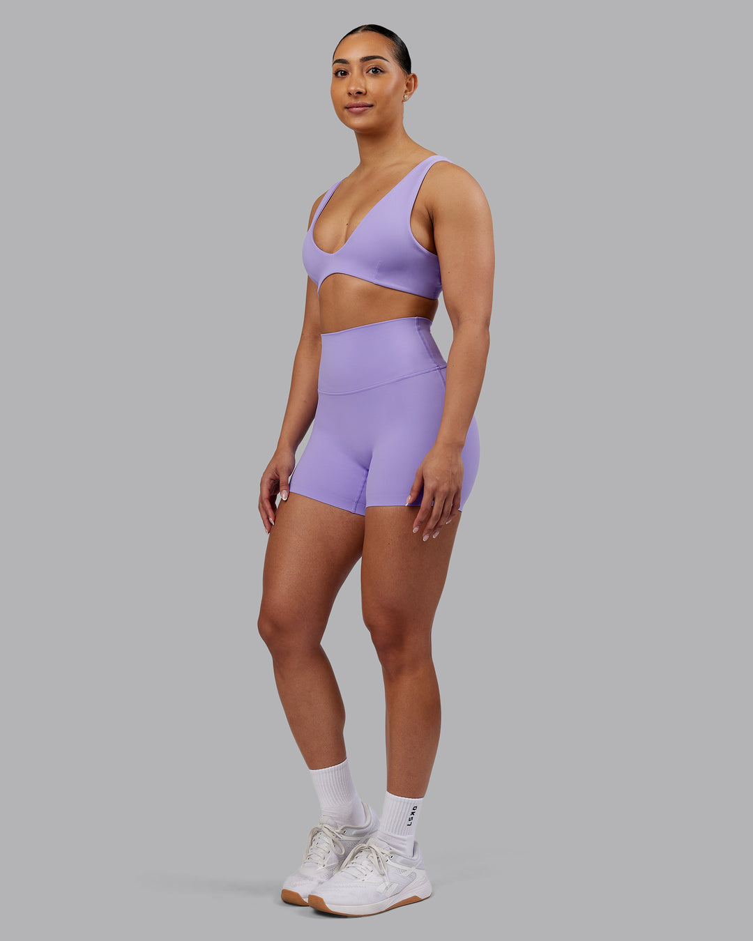 Woman wearing Elixir Ultra High-Rise 4" Short - Violet Ray | Model:Ayla | Size:S