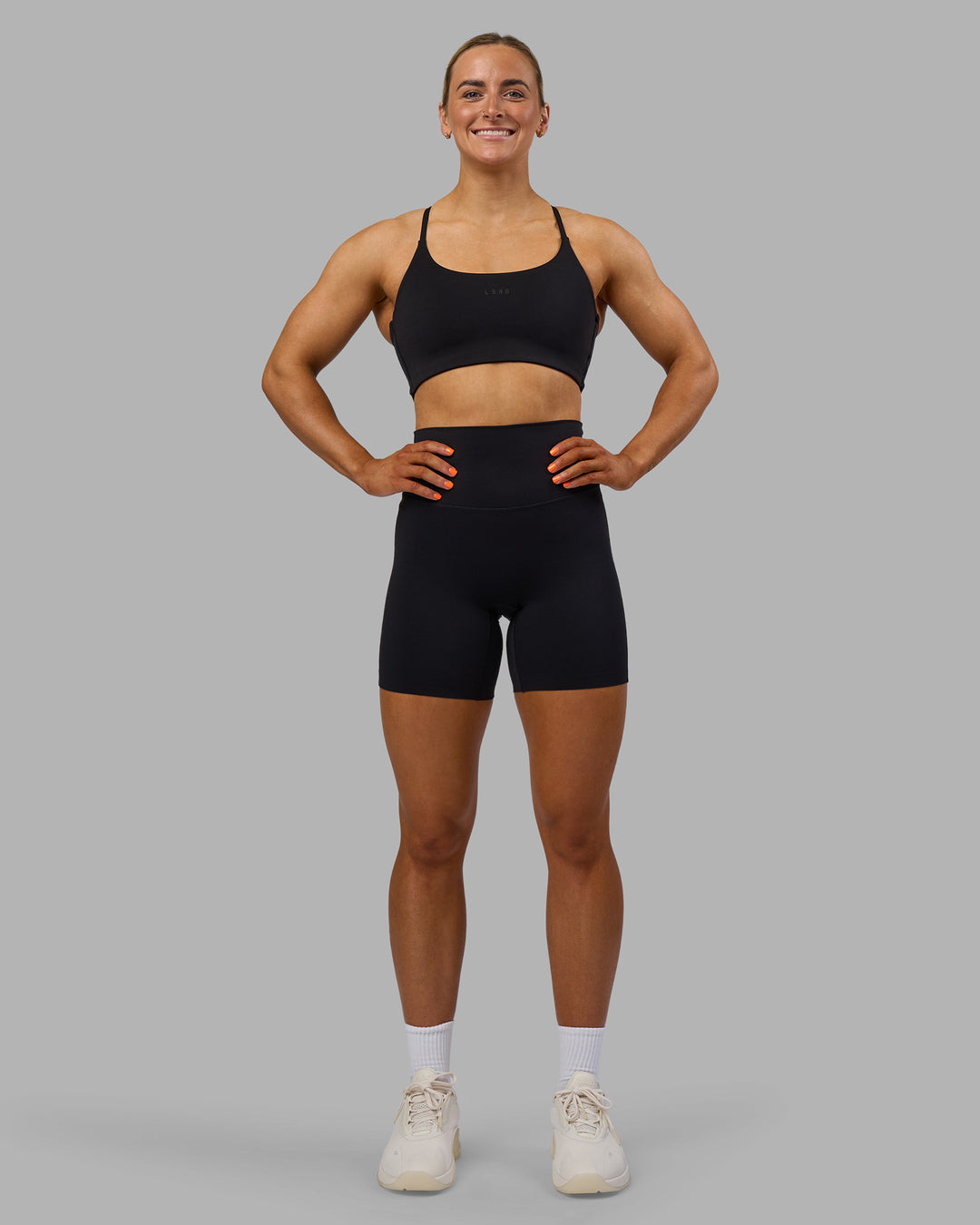 Woman wearing Elixir Ultra High-Rise 6" Short - Black | Model:Georgia | Size:S