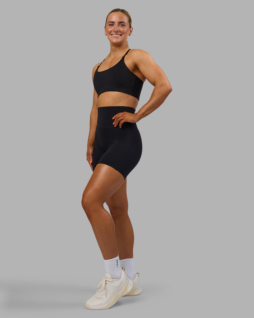 Woman wearing Elixir Ultra High-Rise 6" Short - Black | Model:Georgia | Size:S