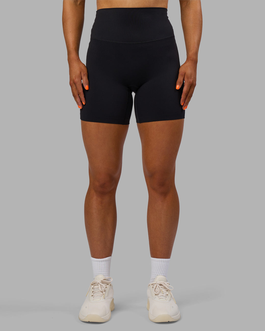 Woman wearing Elixir Ultra High-Rise 6" Short - Black | Model:Georgia | Size:S