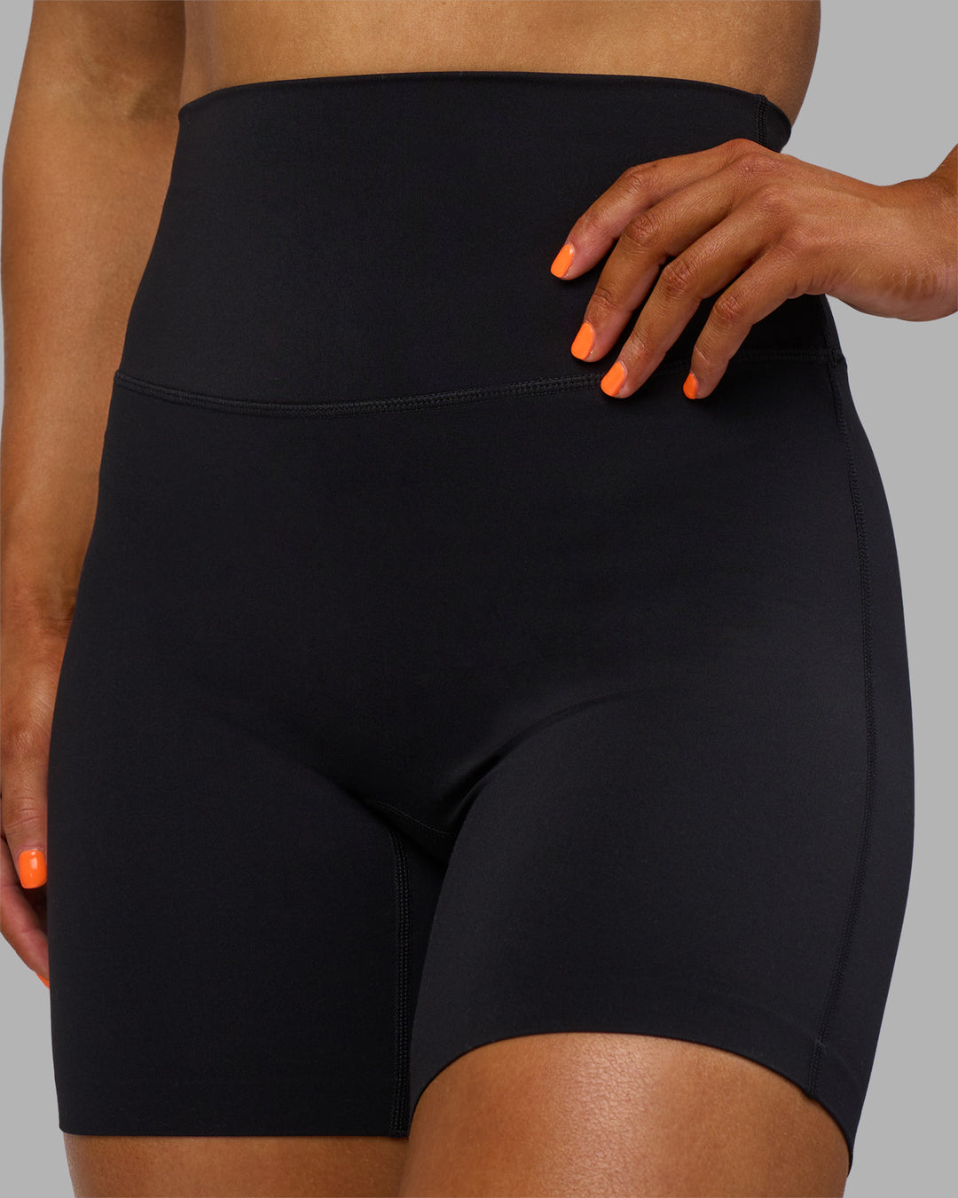 Woman wearing Elixir Ultra High-Rise 6" Short - Black | Model:Georgia | Size:S