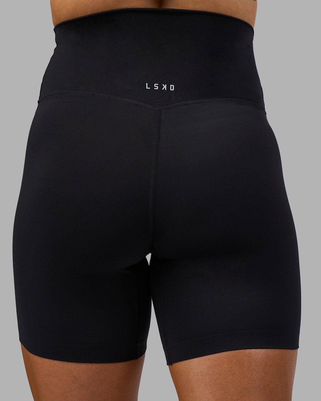 Woman wearing Elixir Ultra High-Rise 6" Short - Black | Model:Georgia | Size:S