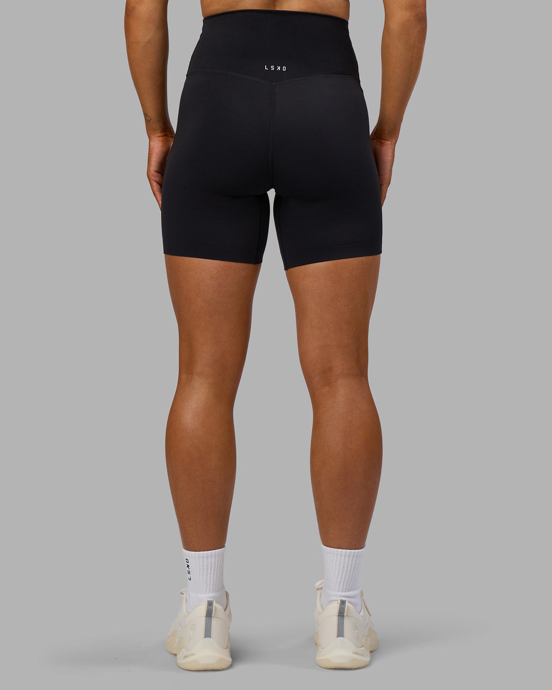 Woman wearing Elixir Ultra High-Rise 6" Short - Black | Model:Georgia | Size:S