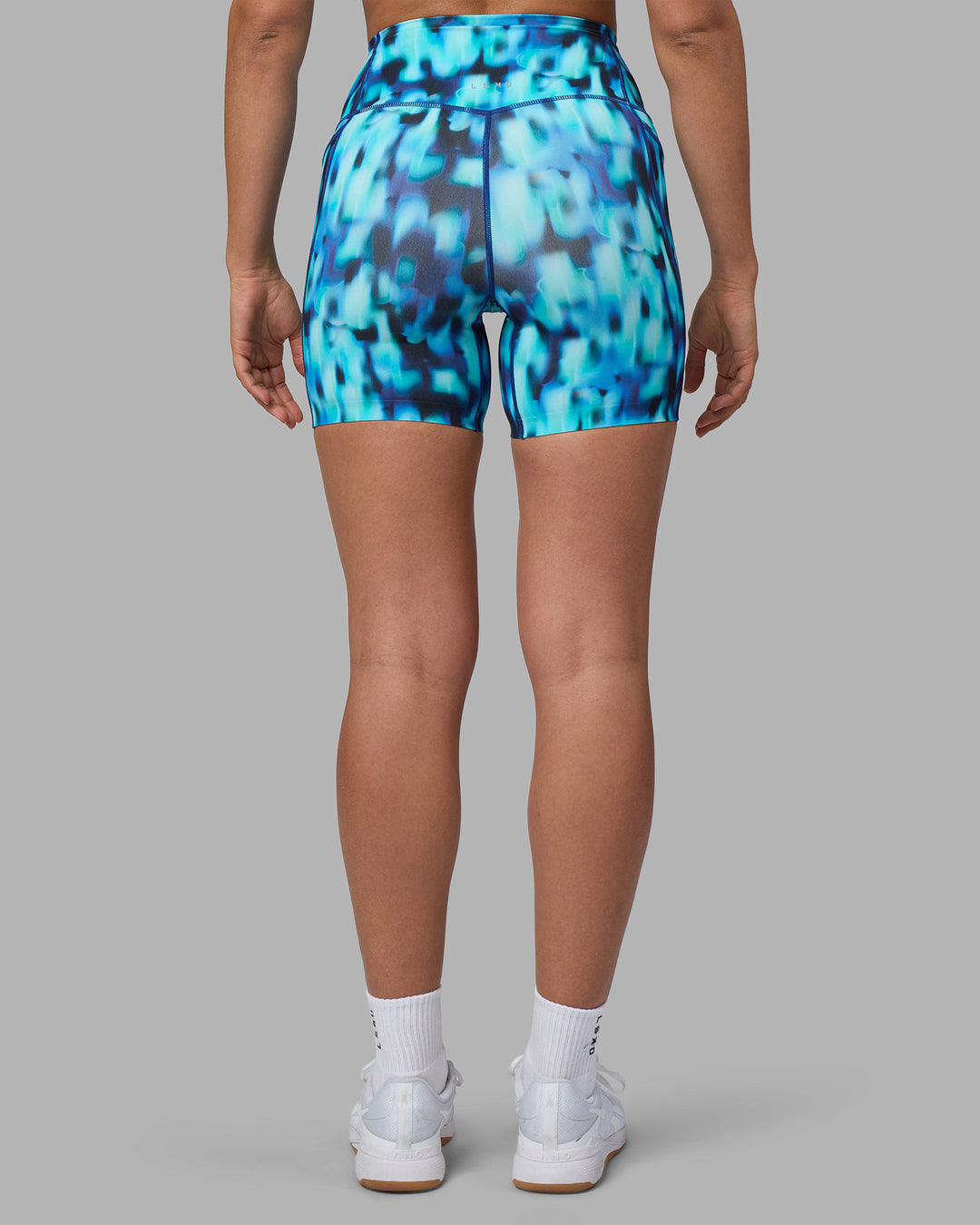 Woman wearing Elixir Ultra High-Rise 6" Short Pockets - Luminous | Model:Sophie | Size:S
