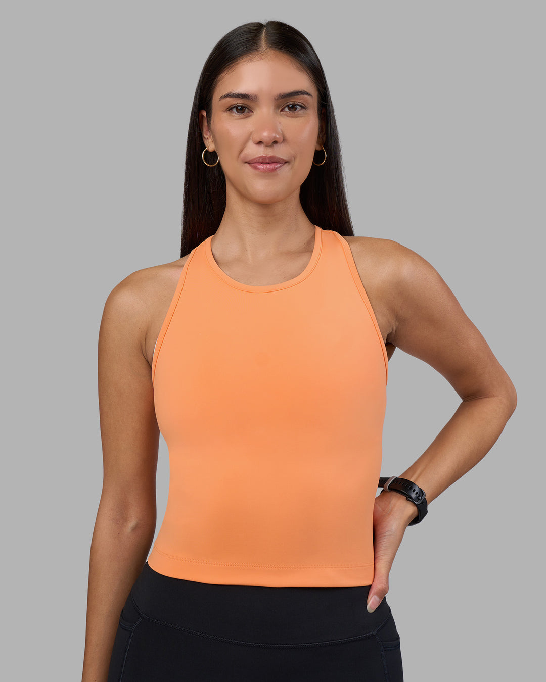 Woman wearing Flow Performance Tank 2.0 - Cantaloupe | Model:Rhiley | Size:S