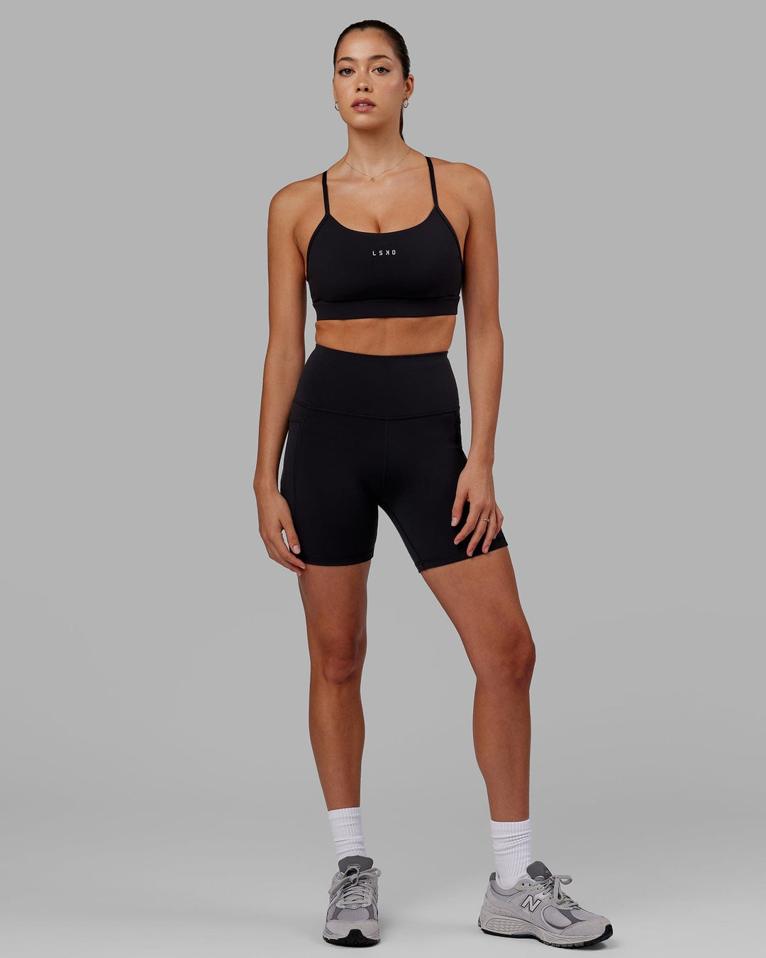 Woman wearing Flux Ultra High-Rise 6" Short Pockets - Black