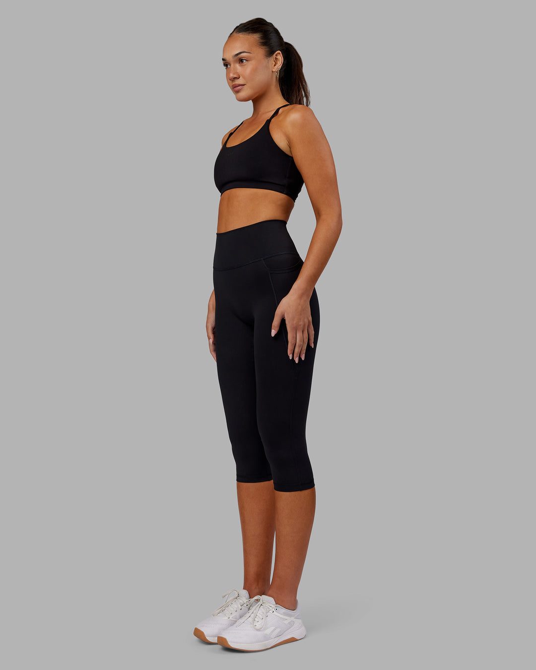 Woman wearing Fusion Ultra High-Rise 3/4 Legging Pockets - Black | Model:Kirstyn | Size:S