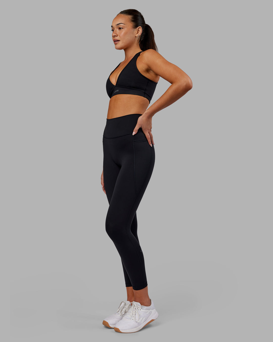 Woman wearing Fusion Ultra High-Rise 7/8 Legging Pockets - Black | Model:Kirstyn | Size:S