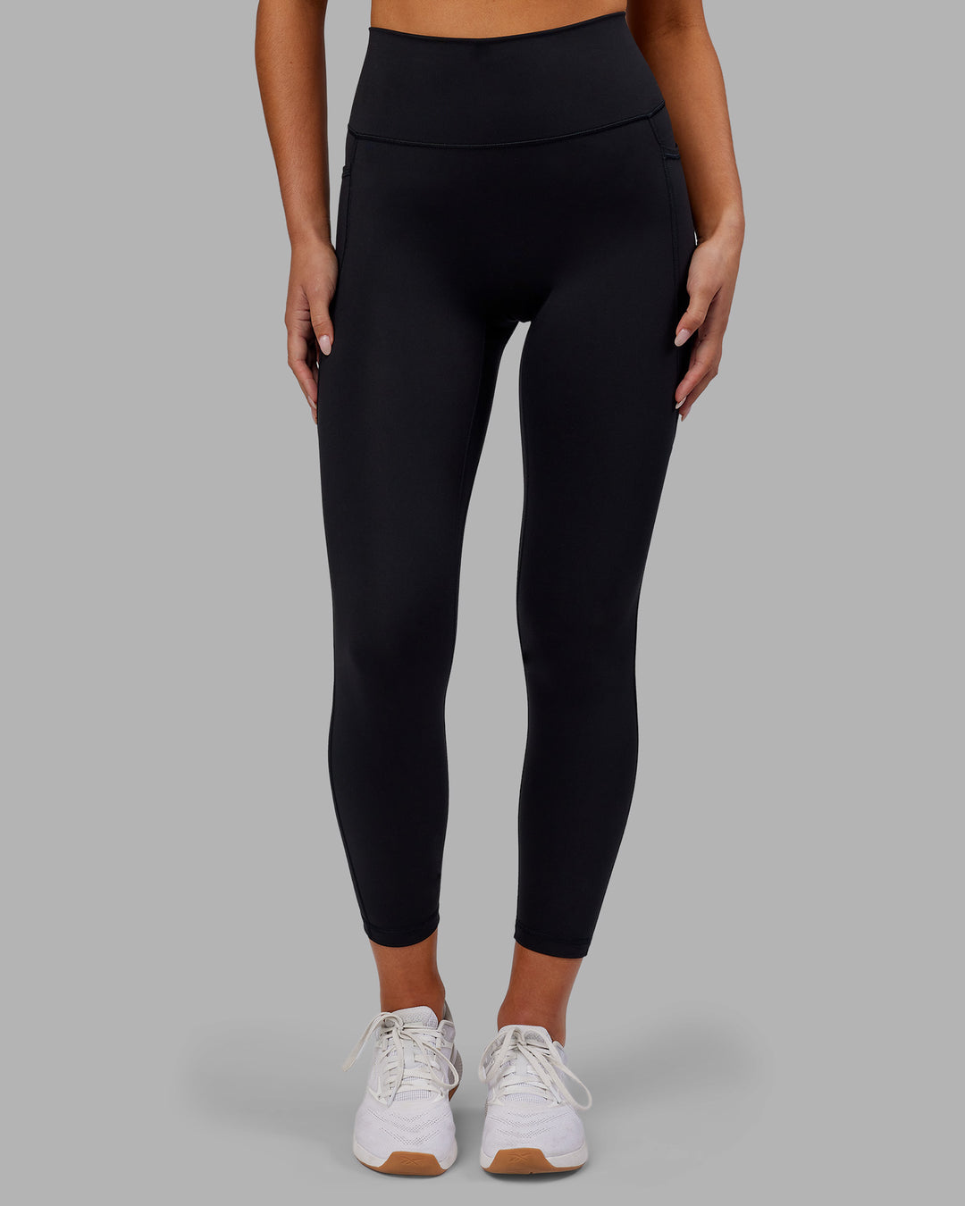 Woman wearing Fusion Ultra High-Rise 7/8 Legging Pockets - Black | Model:Kirstyn | Size:S