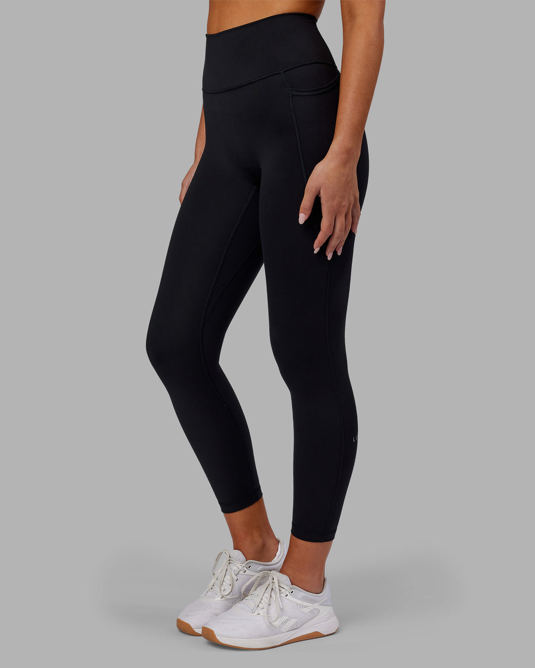 Woman wearing Fusion Ultra High-Rise 7/8 Legging Pockets - Black | Model:Kirstyn | Size:S