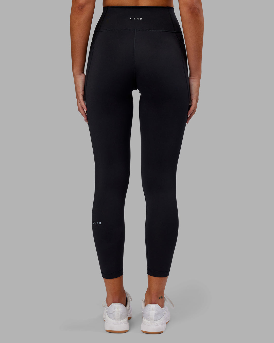 Woman wearing Fusion Ultra High-Rise 7/8 Legging Pockets - Black | Model:Kirstyn | Size:S