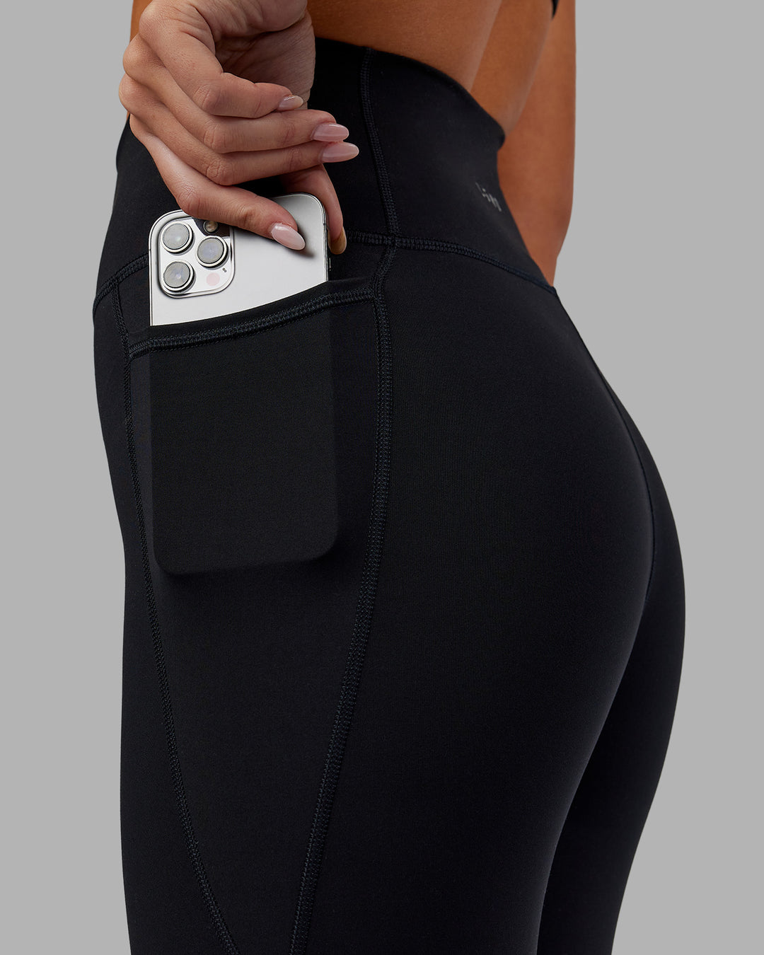 Woman wearing Fusion Ultra High-Rise 7/8 Legging Pockets - Black | Model:Kirstyn | Size:S