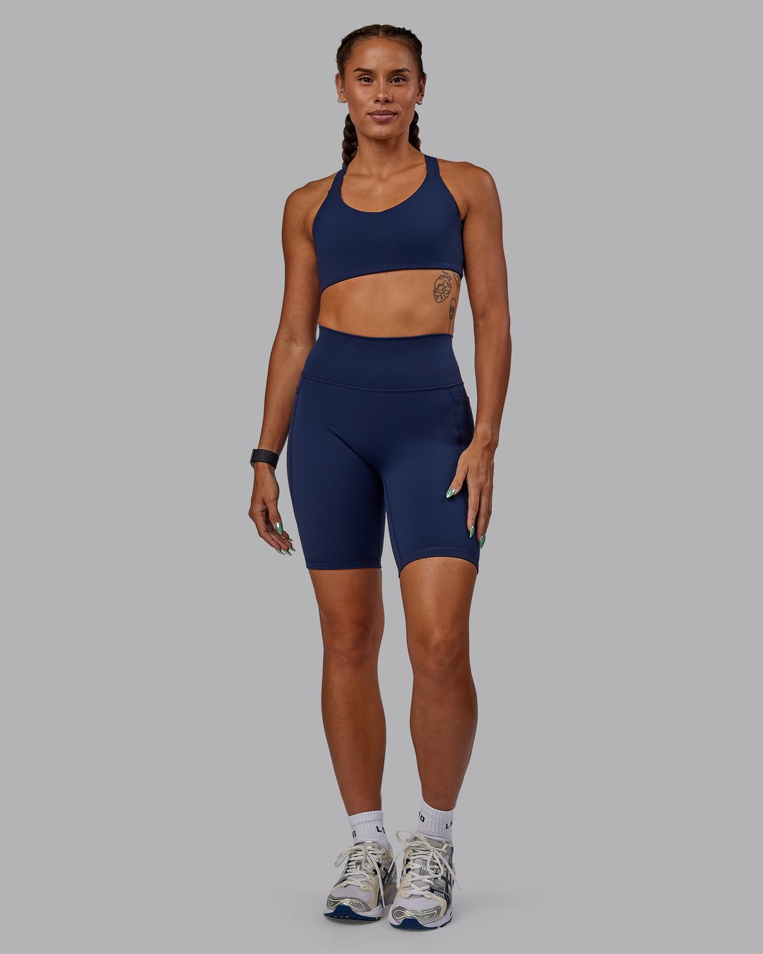 Woman wearing Fusion Ultra High-Rise 9" Short Pockets - Future Navy | Model:Vanessa | Size:S
