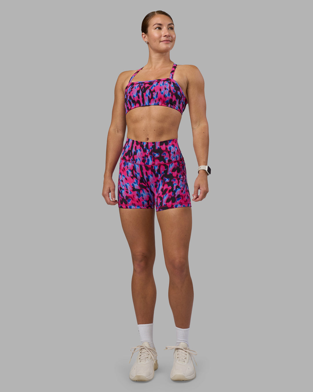 Woman wearing Fusion High-Rise 4" Short Pockets - Pink Luminous | Model:Hannah | Size:S
