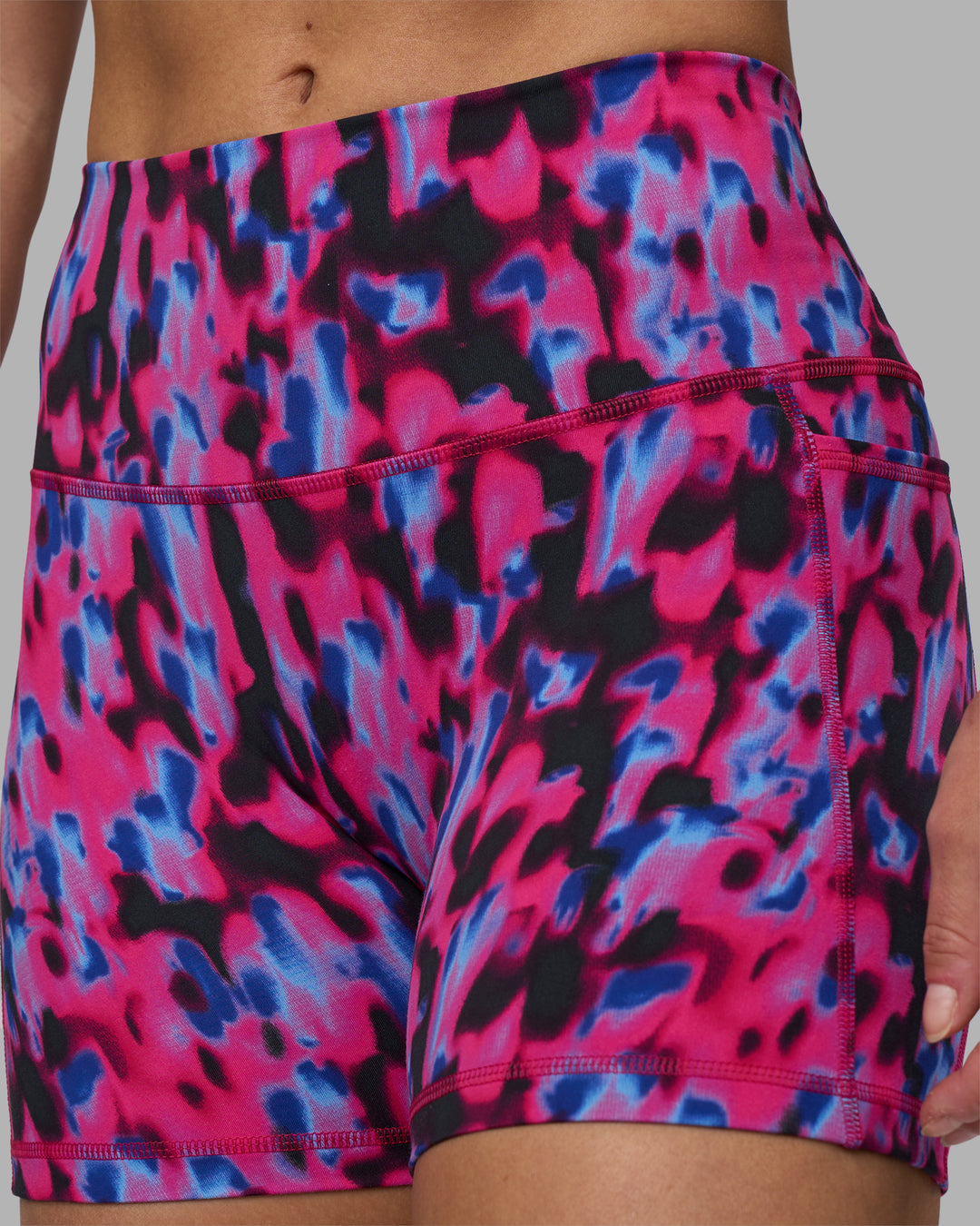 Woman wearing Fusion High-Rise 4" Short Pockets - Pink Luminous | Model:Hannah | Size:S