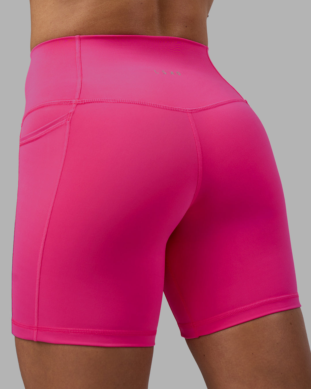 Woman wearing Fusion High-Rise 6" Short Pockets - Ultra Pink | Model:Hannah | Size:S