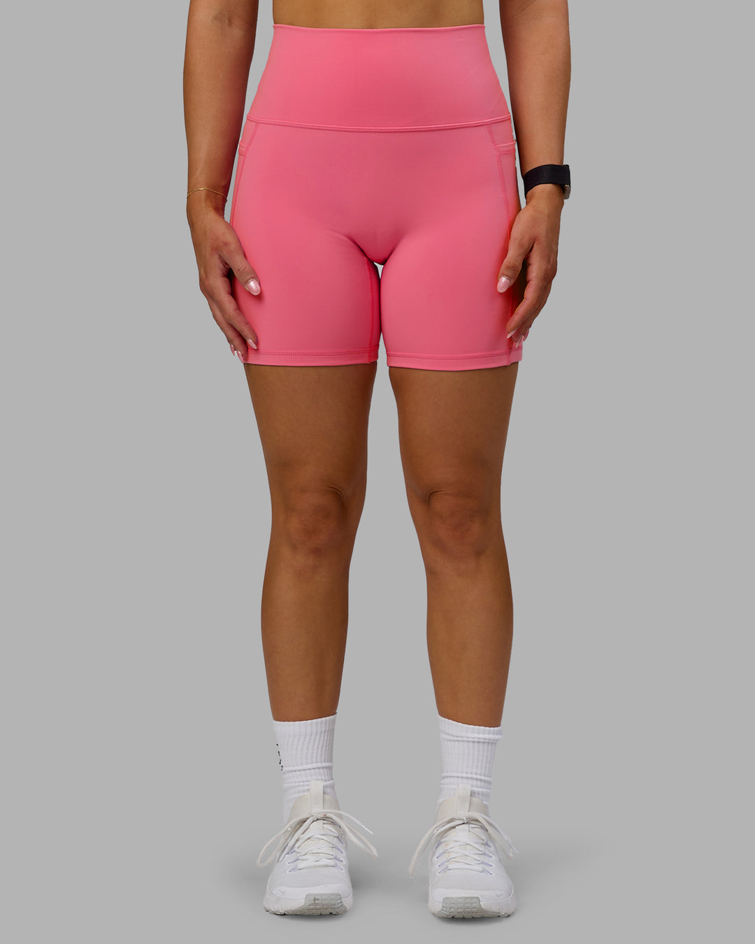 Woman wearing Fusion Ultra High-Rise 6" Short Pockets - Pink Lemonade | Model:Halle | Size:S