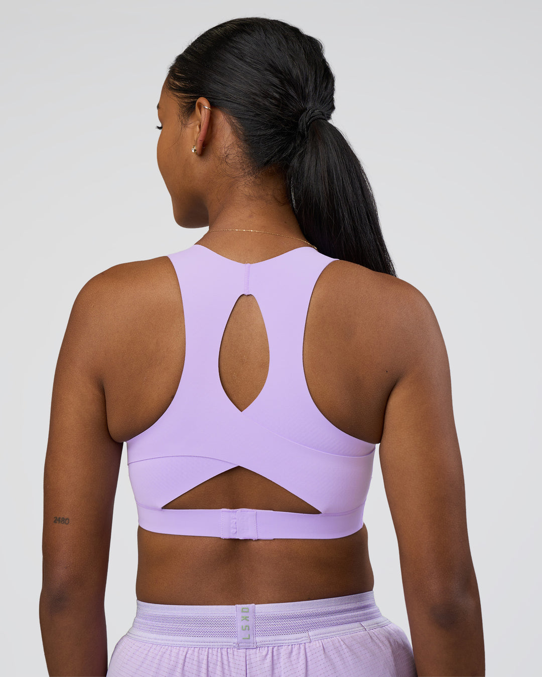 Woman wearing Fusion Sports Bra 2.0 - Pale Lilac | Model:Rica | Size:S