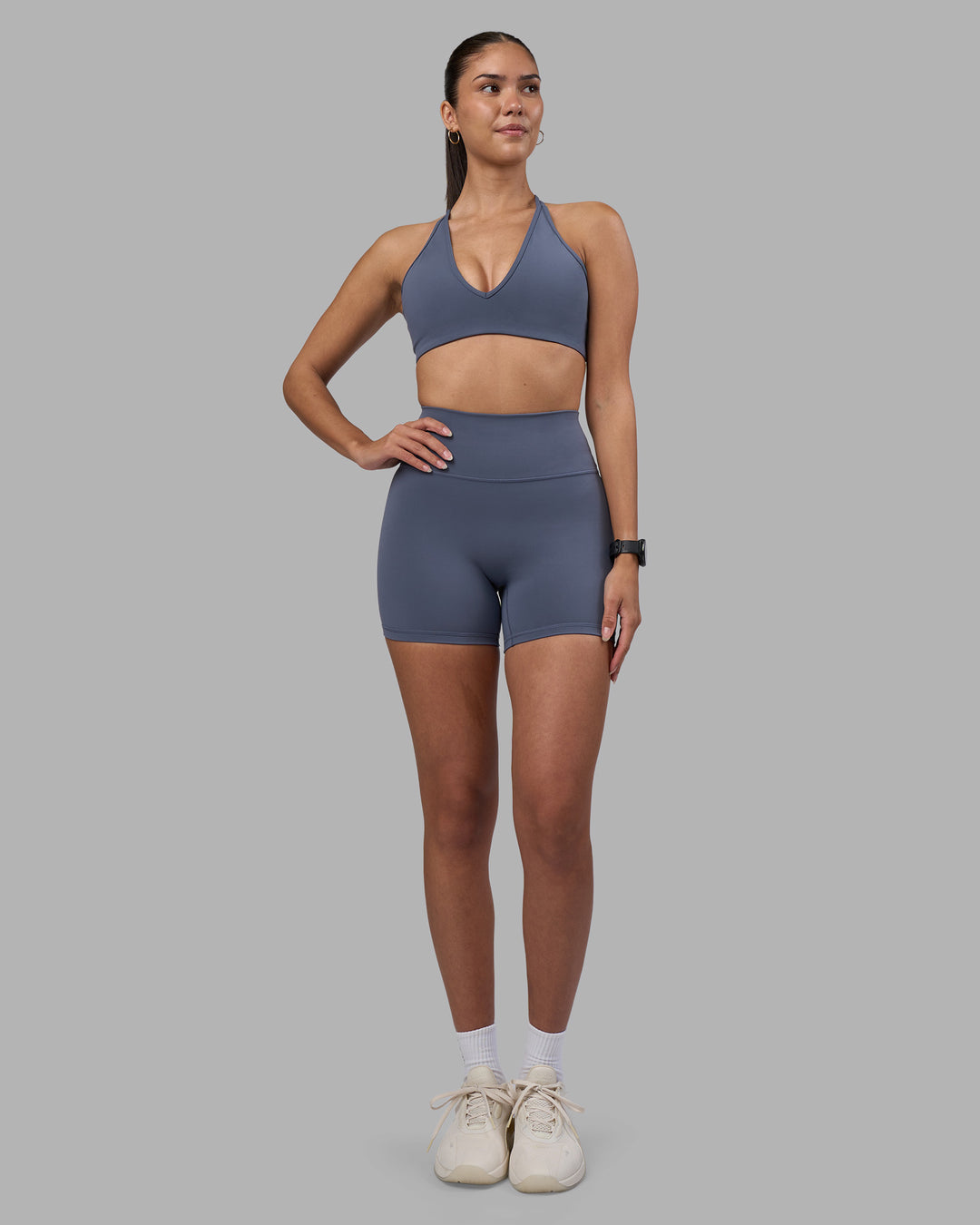 Woman wearing Fusion Ultra High-Rise 4" Short - Night Shadow | Model:Rhiley | Size:S