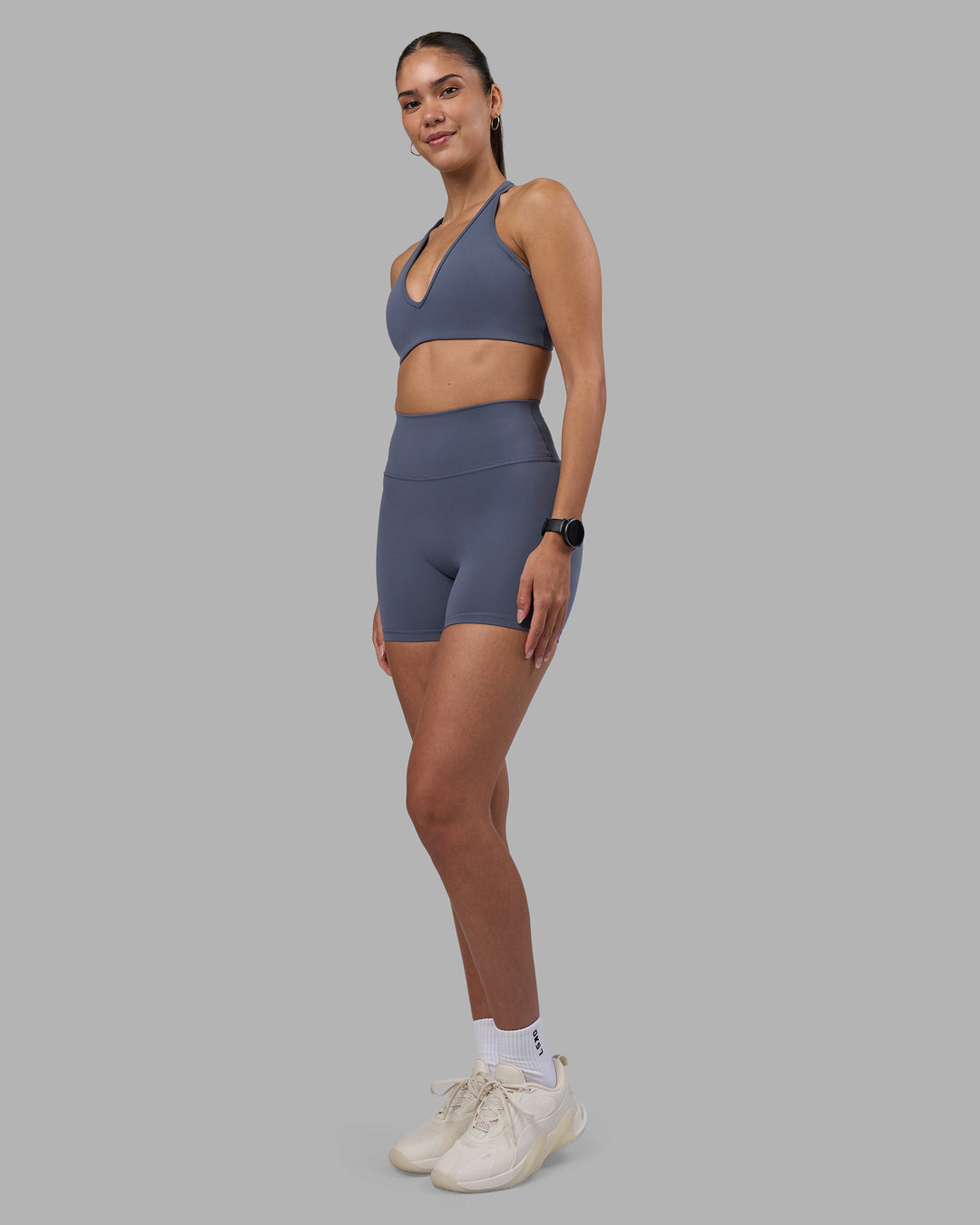 Woman wearing Fusion Ultra High-Rise 4" Short - Night Shadow | Model:Rhiley | Size:S
