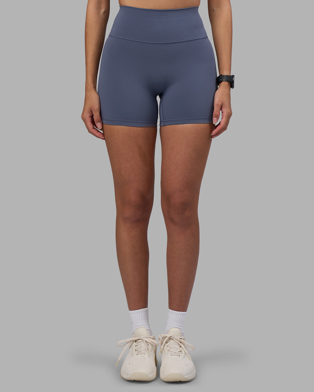 Woman wearing Fusion Ultra High-Rise 4" Short - Night Shadow | Model:Rhiley | Size:S