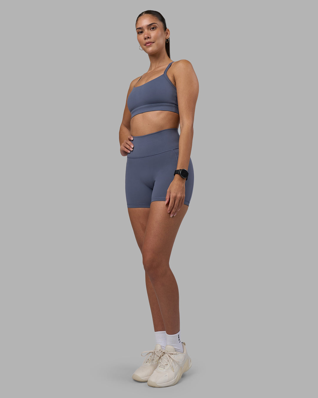 Woman wearing Fusion Ultra High-Rise 4" Short Pockets - Night Shadow | Model:Rhiley | Size:S