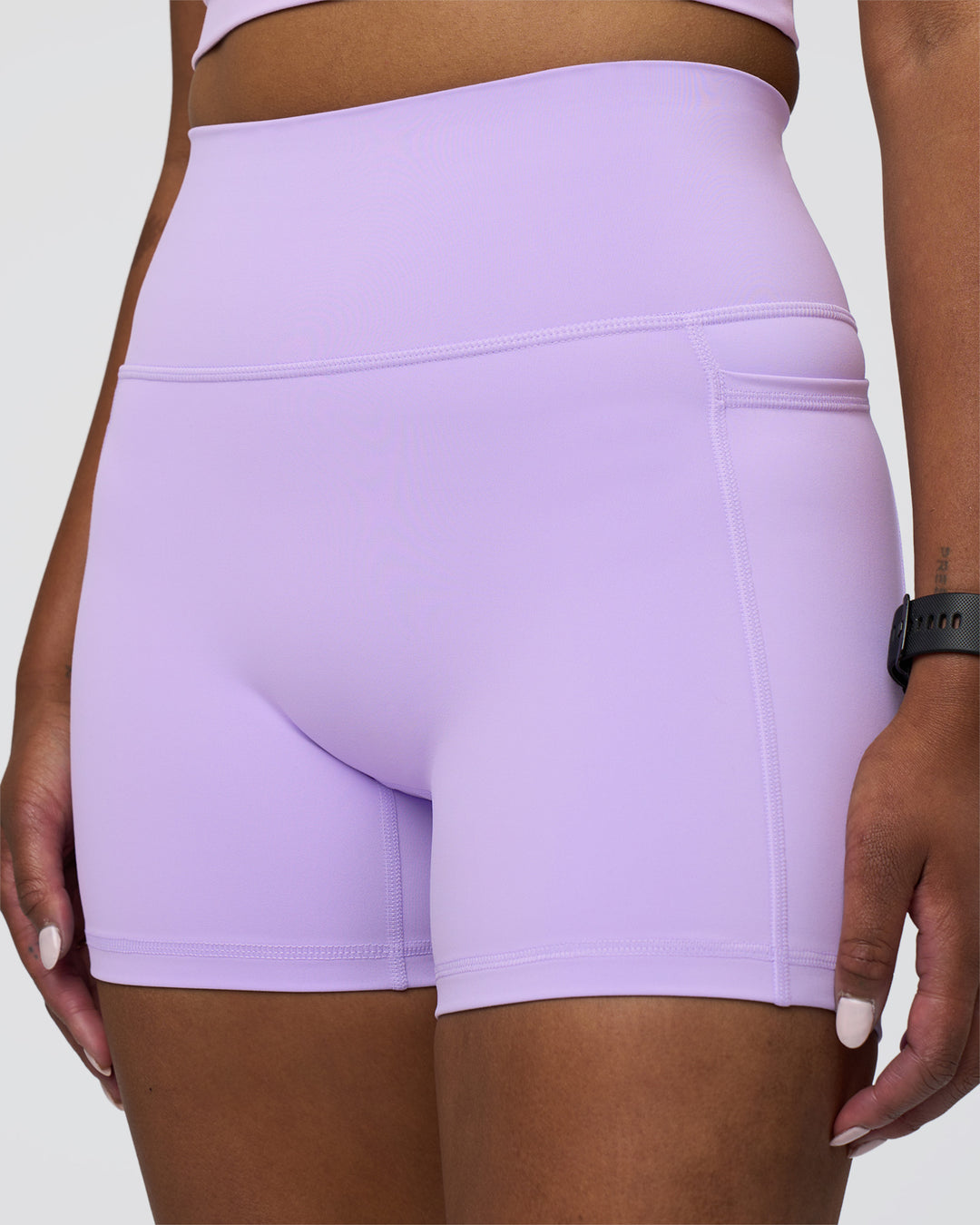 Woman wearing Fusion Ultra High-Rise 4" Short Pockets - Pale Lilac | Model:Rica | Size:S