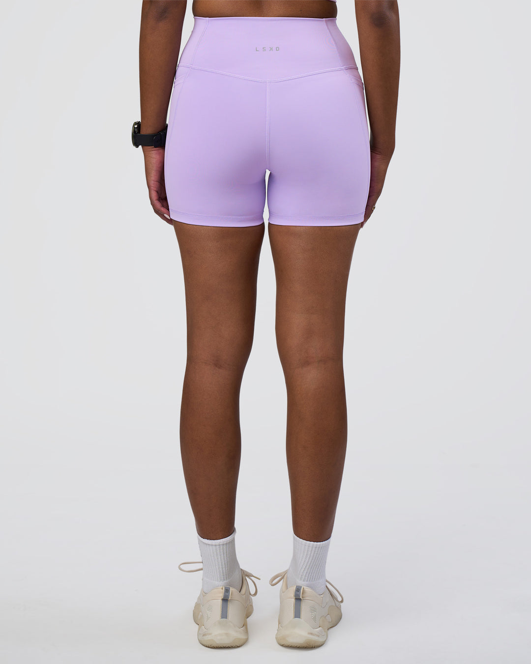 Woman wearing Fusion Ultra High-Rise 4" Short Pockets - Pale Lilac | Model:Rica | Size:S