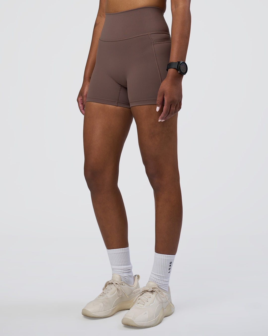 Woman wearing Fusion Ultra High-Rise 4" Short Pockets - Peppercorn | Model:Rica | Size:S