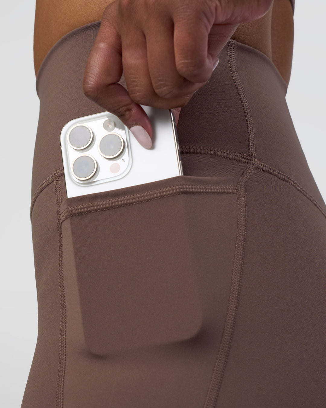 Woman wearing Fusion Ultra High-Rise 4" Short Pockets - Peppercorn | Model:Rica | Size:S