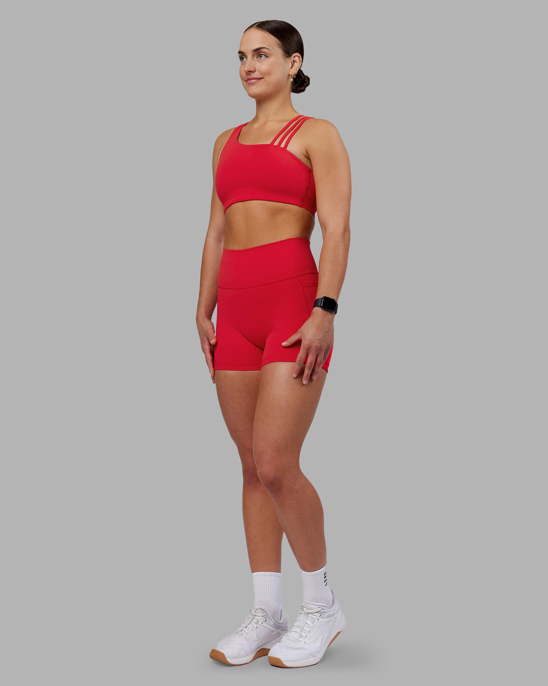 Woman wearing Fusion Ultra High-Rise 4" Short Pockets - Scarlet | Model:Keisha | Size:S