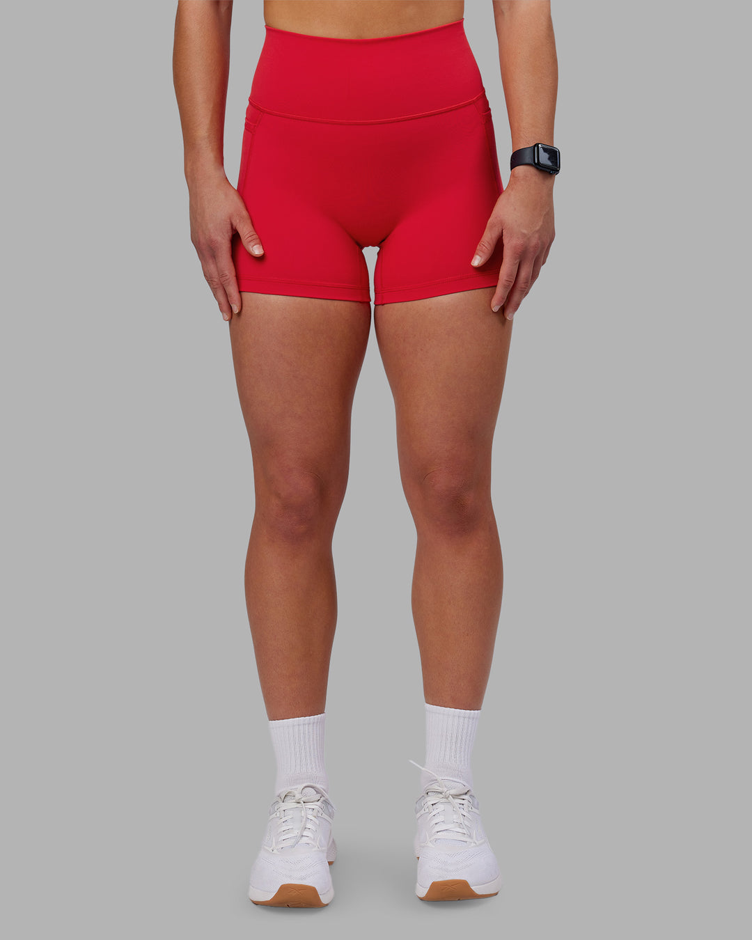 Woman wearing Fusion Ultra High-Rise 4" Short Pockets - Scarlet | Model:Keisha | Size:S